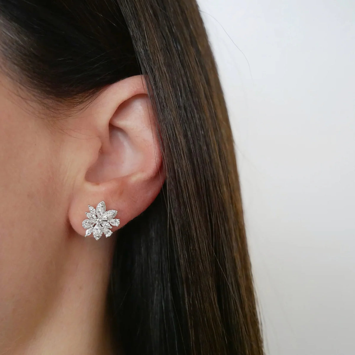 EF-Collection Marquise Diamond Cluster Stud Earrings in white gold styled on models ear