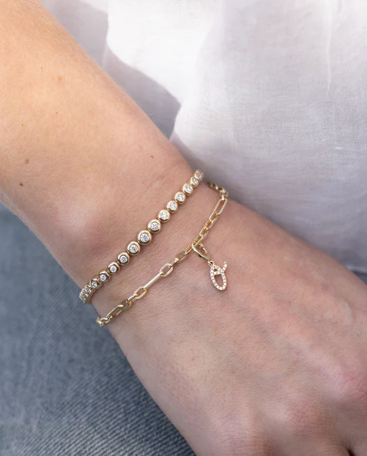 EF Collection Mini Mixed Chain Bracelet in yellow gold styled on model's wrist with charm.