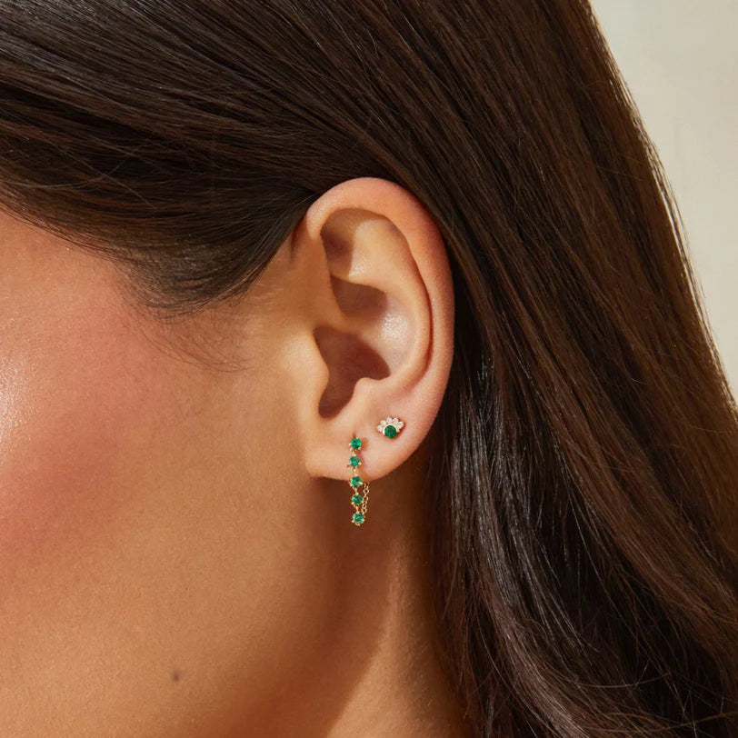 EF-Collection Multi Emerald Chain Stud Earrings in yellow gold styled on models ear with emerald stud
