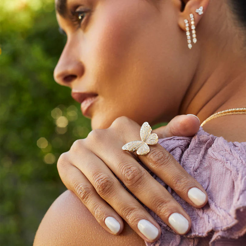 Single EF Collection Pavé Diamond Jumbo Butterfly Ring in yellow gold on model’s finger.