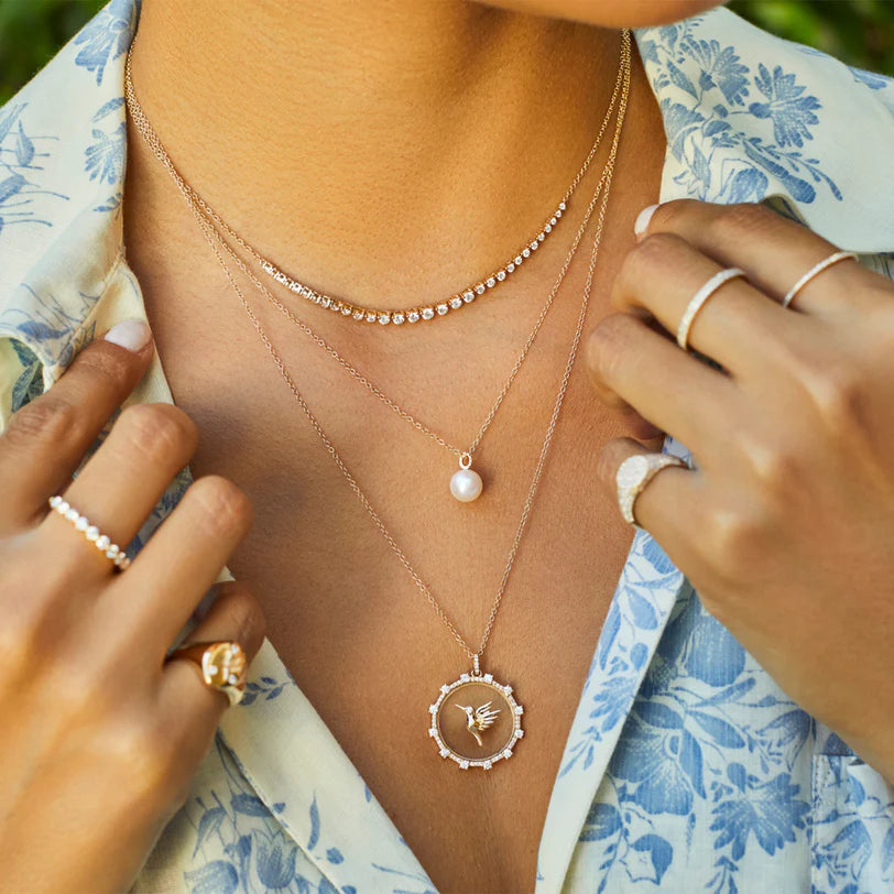 EF Collection Pearl Ball Drop Necklace in white gold on styled on models neck.