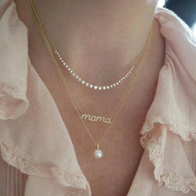 Close up of EF Collection Pearl Ball Drop Necklace in yellow gold on models neck