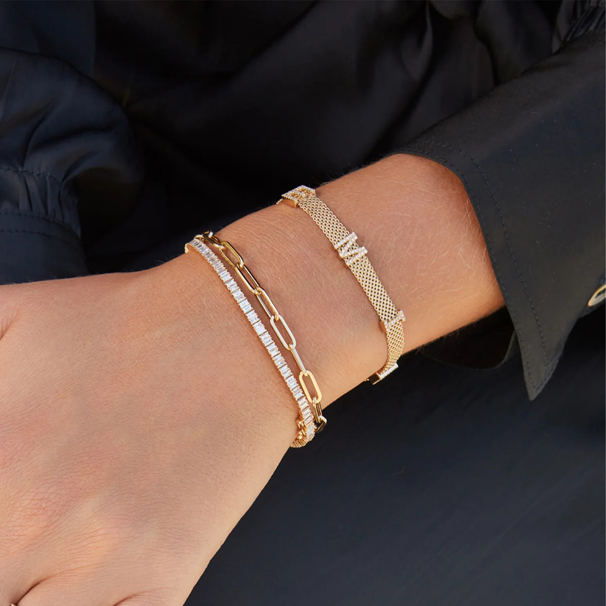 EF Collection Prong Set Diamond Baguette Eternity Bracelet in yellow gold on models wrist