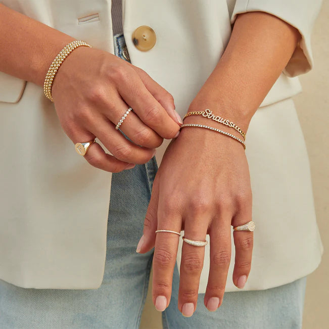 EF Collection Prong Set Diamond Ring in yellow gold styled on model’s finger.