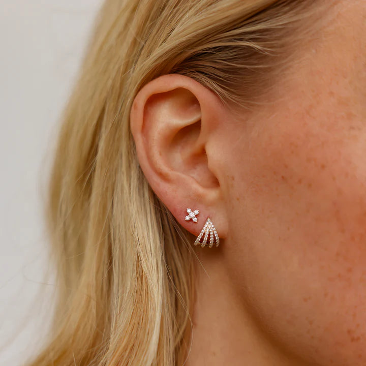 Dana Rebecca Designs Sarah Leah Four Burst Huggies in rose gold on models ear with x styled stud