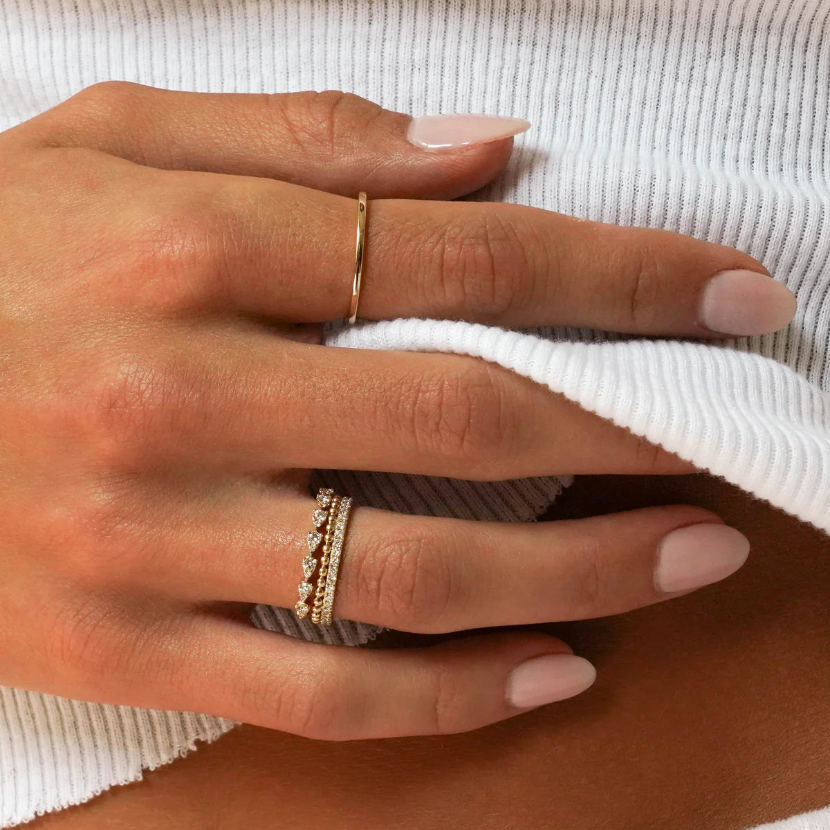 Dana Rebecca Designs Sophia Ryan Teardrop Band Ring in yellow gold on models hand stacked with other diamond rings