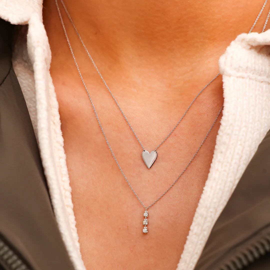 Close up of Dana Rebecca Designs Sophia Ryan Triple Teardrop Necklace in white gold on models neck