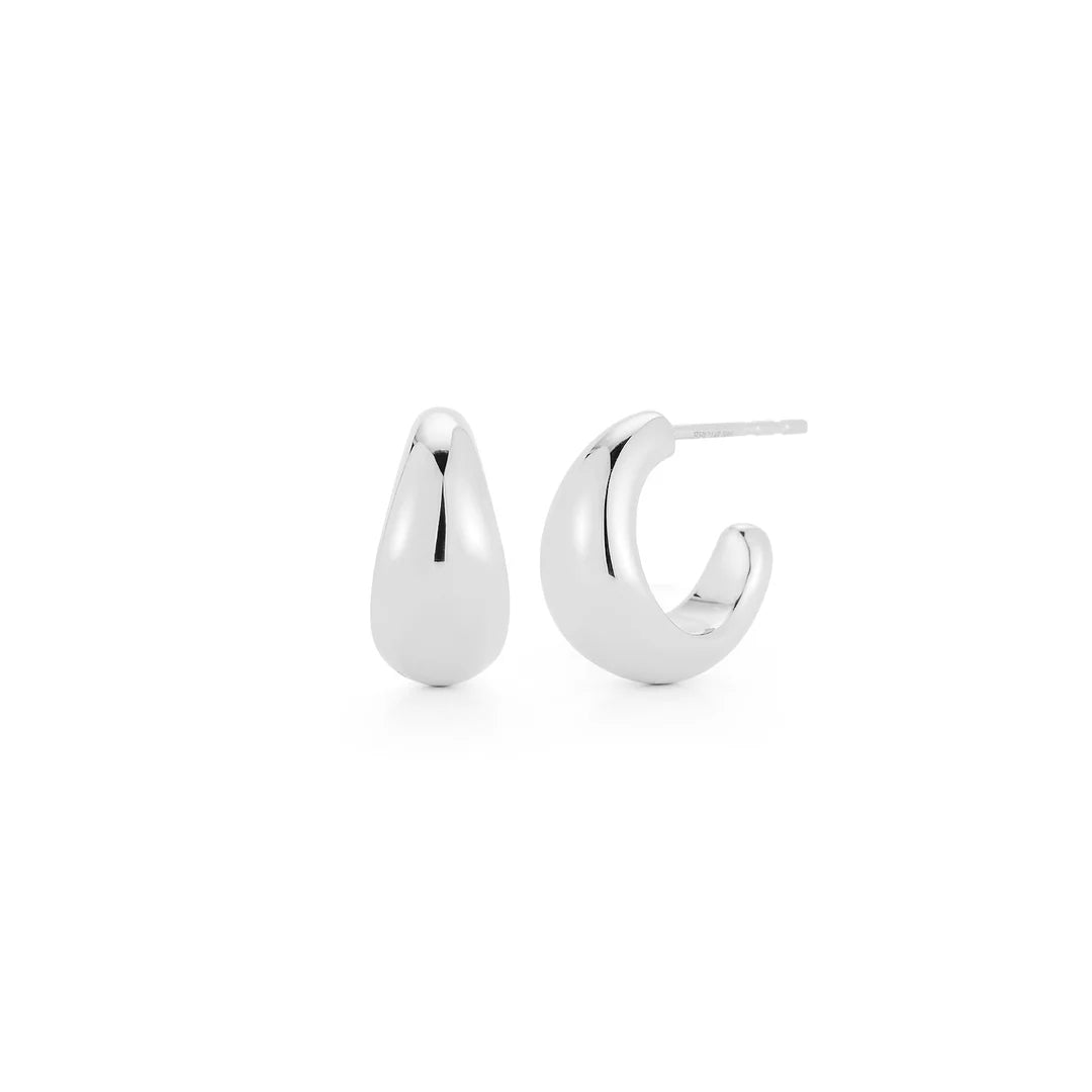 EF-Collection The Gold Jumbo Dome Huggie Earrings in white gold on white background
