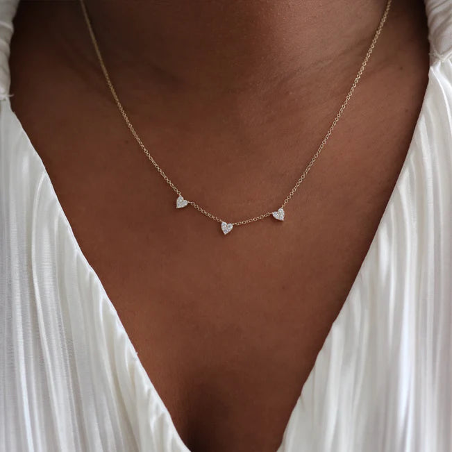 Single EF Collection Triple Full Cut Diamond Heart Necklace in yellow gold on models neck.