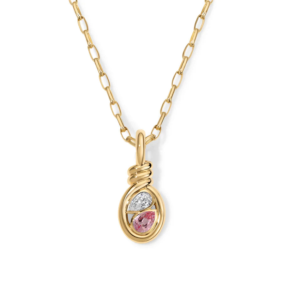 Rosario Navia Twist Two-Stone Pendant - Diamond & Pink Sapphire in yellow gold on white background