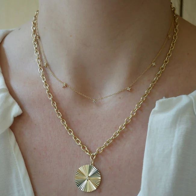EF Collection 7 Diamond Sparkle Necklace in yellow gold on models neck layered with a diamond disc necklace.