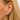 Styled Dana Rebecca Designs E1511 Sarah Leah Four Burst Huggies, showcasing delicate hoop earrings with four sparkling bursts of round-cut diamonds. The huggies are crafted in sleek, polished metal, providing a modern and elegant look. Perfect for everyday wear or special occasions, these earrings add a touch of luxury and shine.