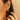 close up shot of DRD Large Tapered Hoops In Yellow Gold on model