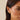 Close-up of a woman wearing Ef Collection Gold Knot Huggie gearrings with a neutral background.
