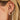 Ef collection Single Bezel Set Emerald Cut Diamond Stud Earring in yellow gold styled on models ear with a big diamond hoop. 
