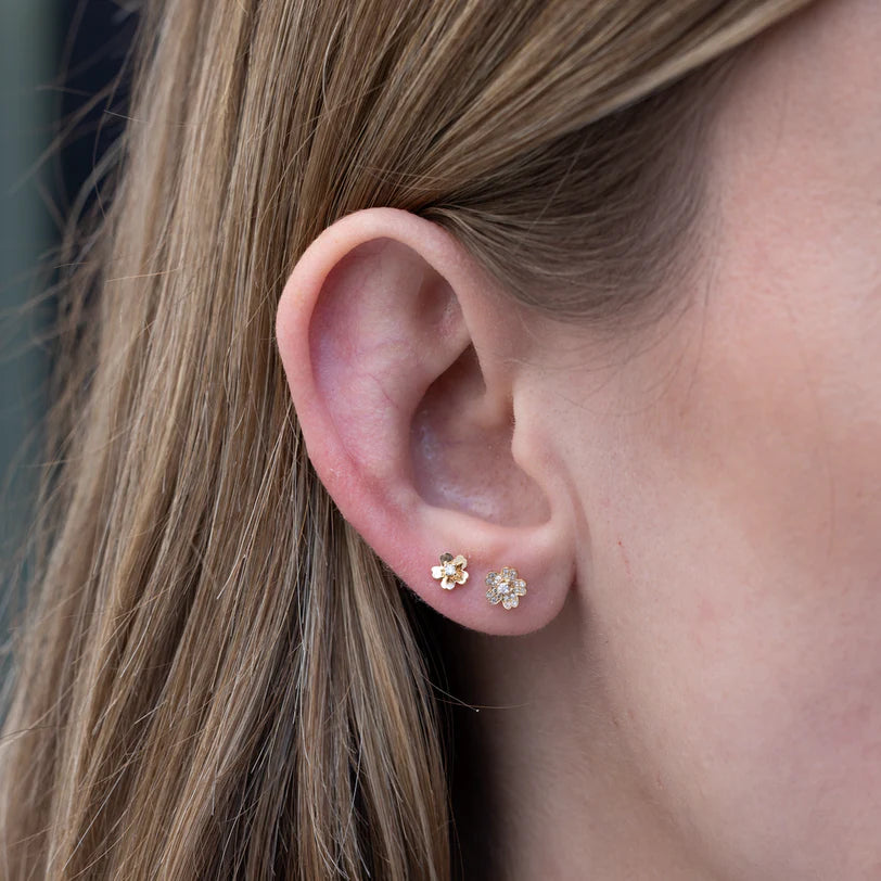 Single EF Collection Diamond Mini Cherry Blossom Stud Earring in yellow gold on models ear. 