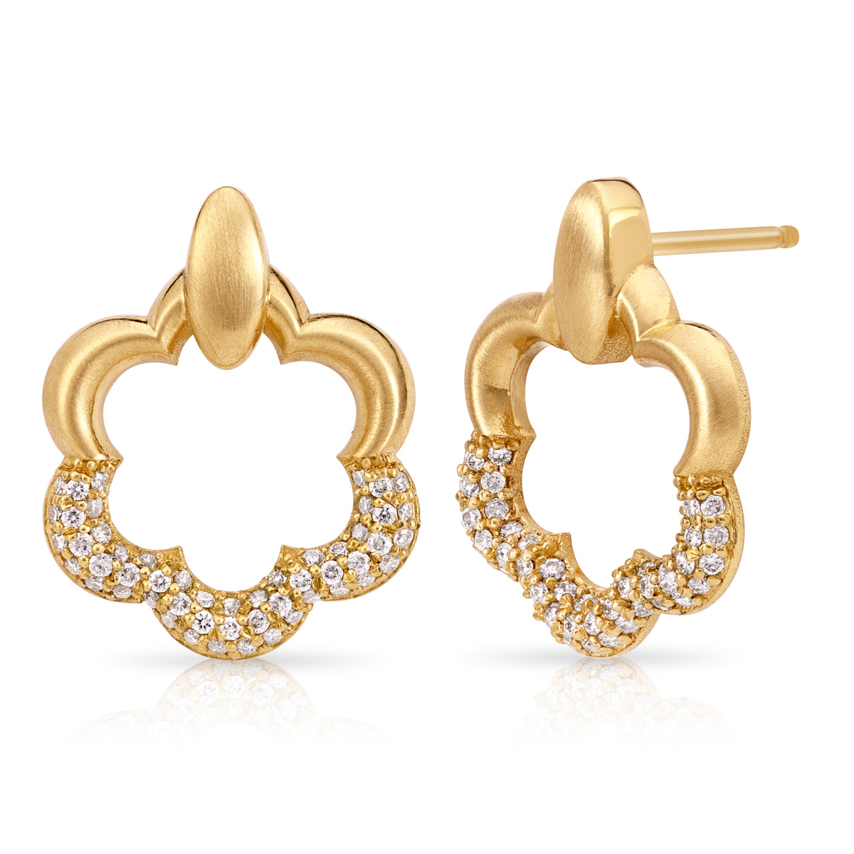 Product shot of Onirikka floret stud earrings in yellow gold on a white background. 