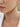 close up of Onirikka Glimmer Wave tennis Necklace in yellow gold on model's neck
