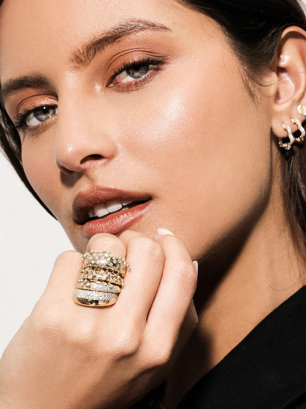 close up of Onirikka Half Pavé Florette Hoops in satin 14k yellow gold