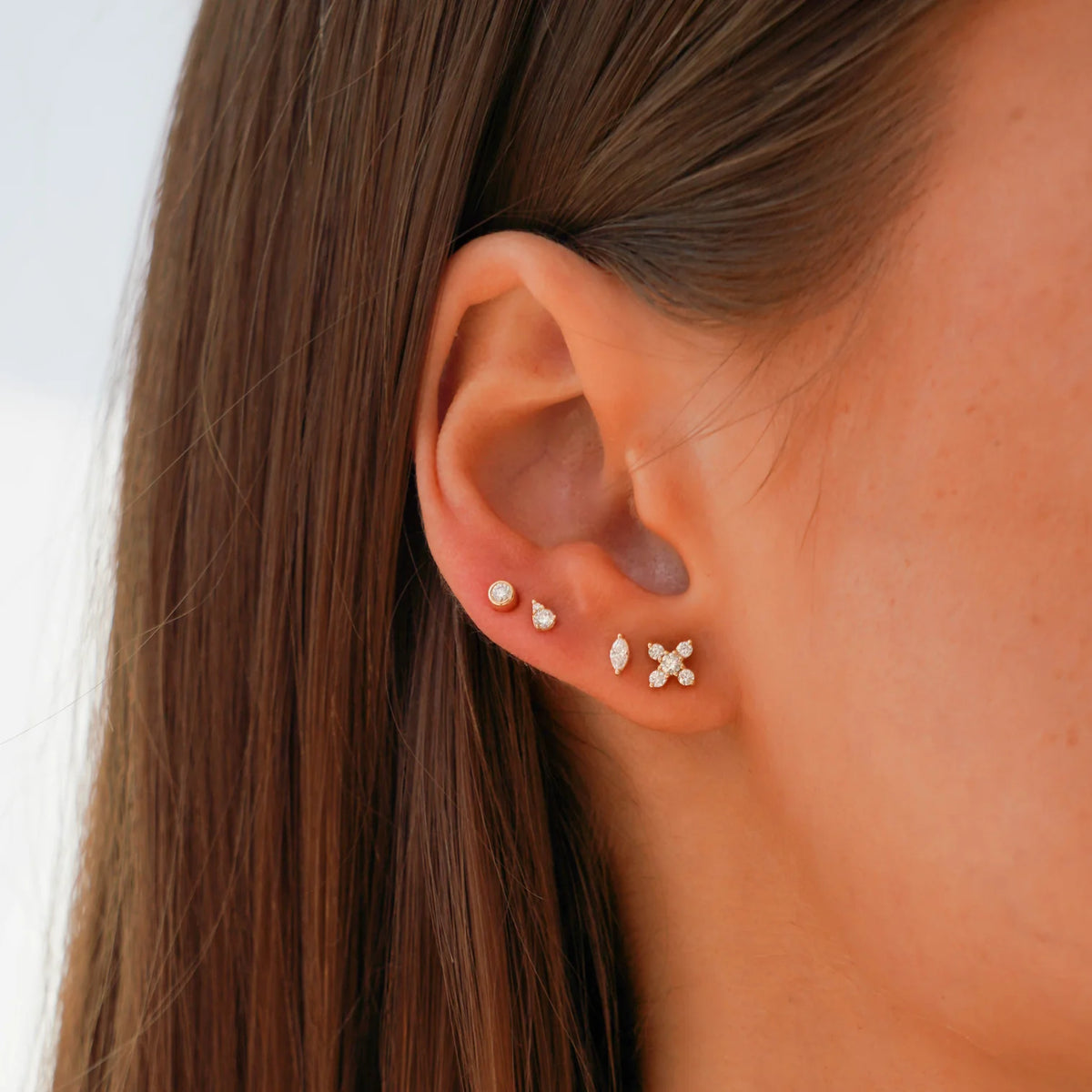 Dana Rebecca Designs Alexa Jordyn Marquise Diamond Single Stud Earring in white gold styled on models ear with three different studs  