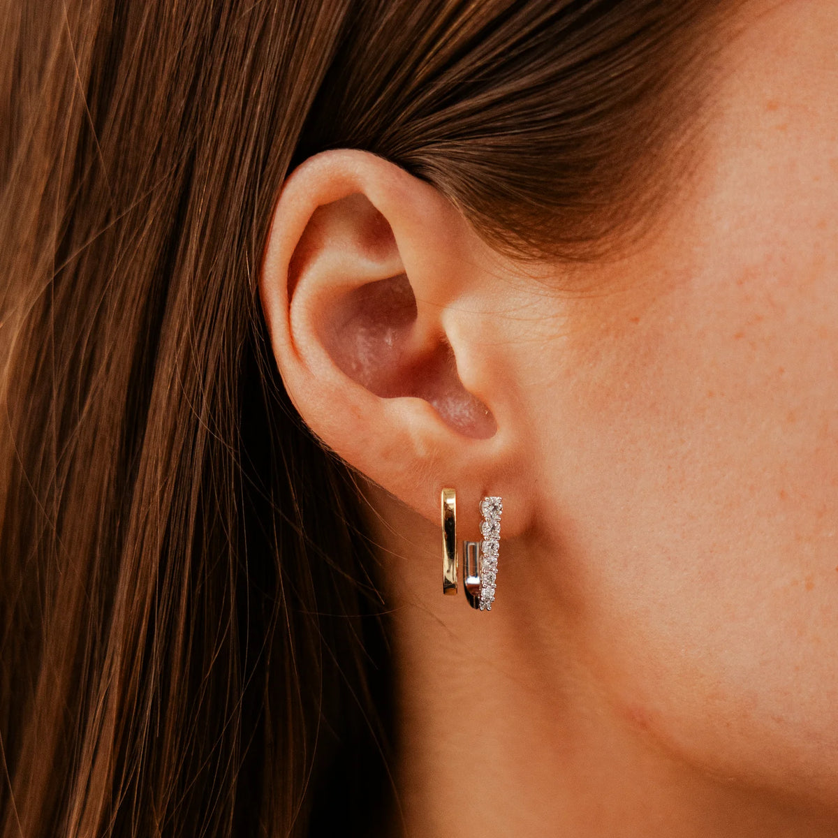 Dana Rebecca Designs Ava Bea Graduating U Hoops in yellow gold on models ear styled with yellow gold hoop 