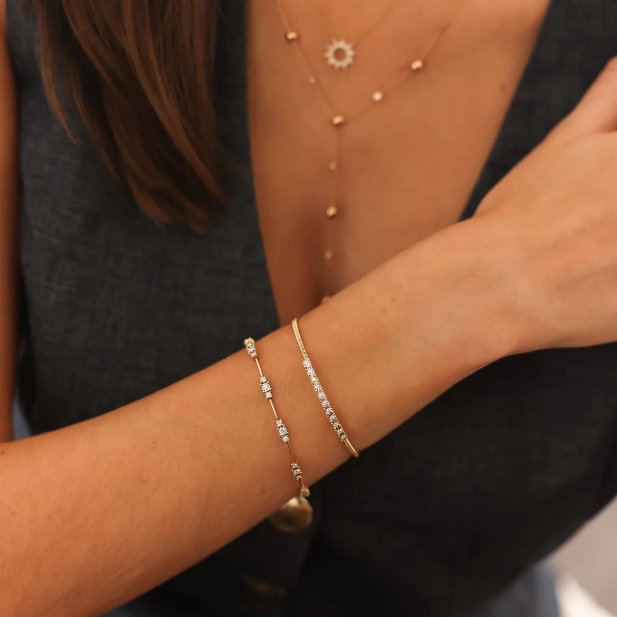 model wearing Dana Rebecca Designs Ava Bea Spaced tennis bracelet in yellow gold and diamonds 