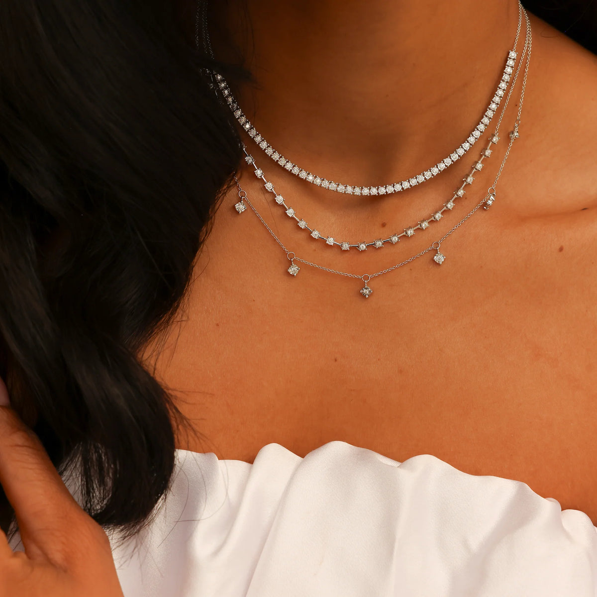 Dana Rebecca Designs Ava Bea Tennis Necklace in white gold styled on models neck wearing a white blouse