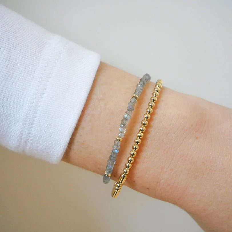 EF-Collection Birthstone Bead Bracelet In Labradorite in yellow gold styled on models wrist with yellow gold bead bracelet 