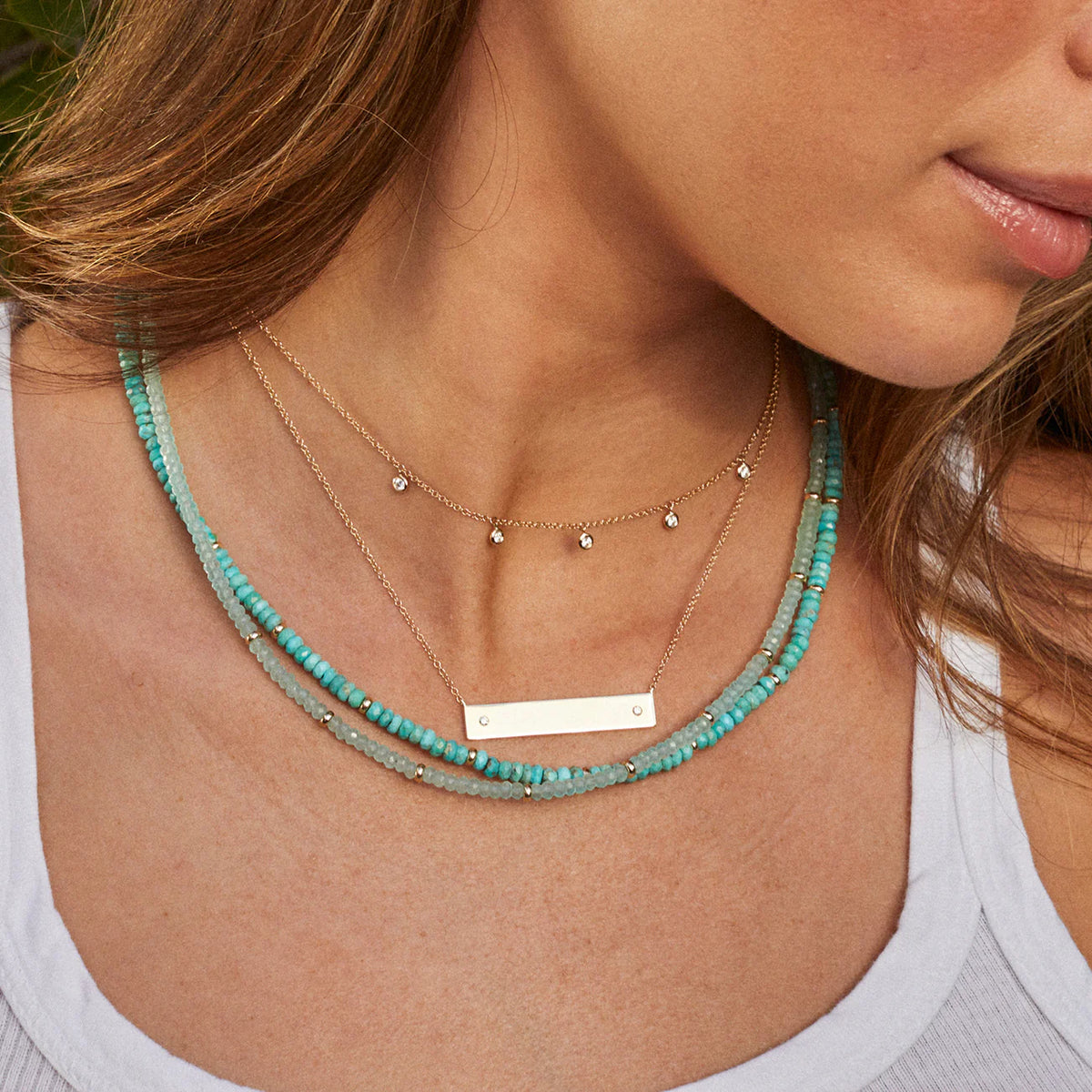 EF-Collection Birthstone Bead Necklace In Turquoise in yellow gold styled on models neck with chalcedony birthstone necklace