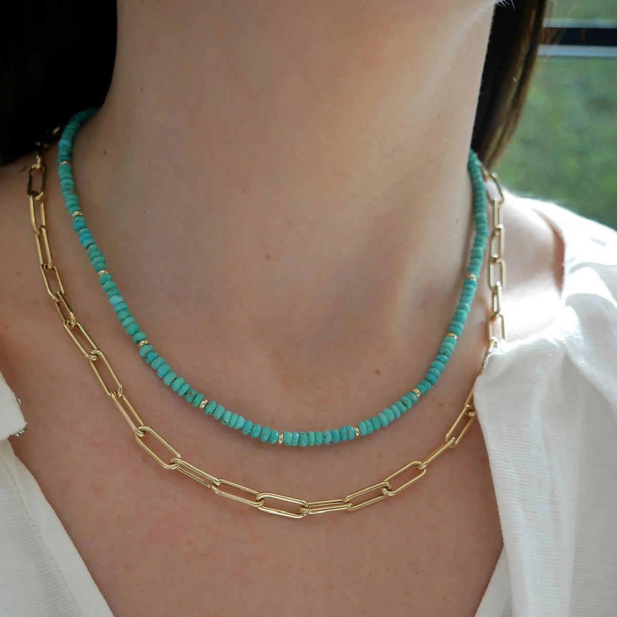 EF-Collection Birthstone Bead Necklace In Turquoise on models neck styled with jumbo chain necklace 