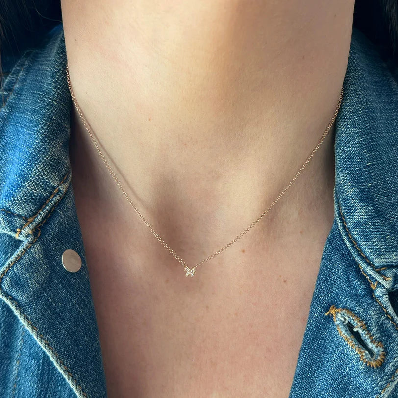 Single EF Collection Diamond Baby Butterfly Necklace in yellow gold on models neck 