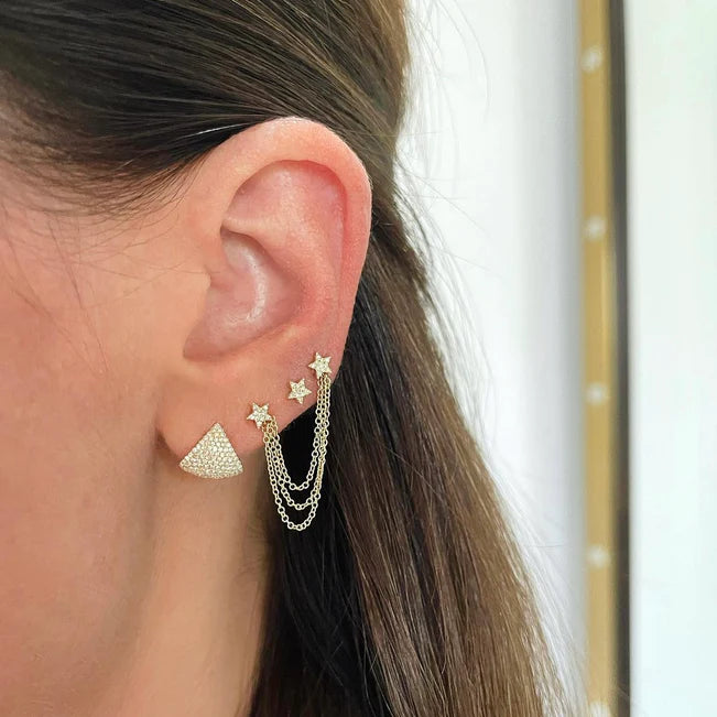 EF Collection Diamond Baby Star Stud Earring in yellow gold on models ear