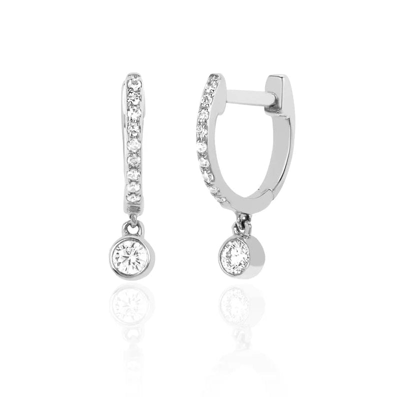 EF Collection Diamond Bezel Drop Mini Huggie Earring in white gold on white background. 