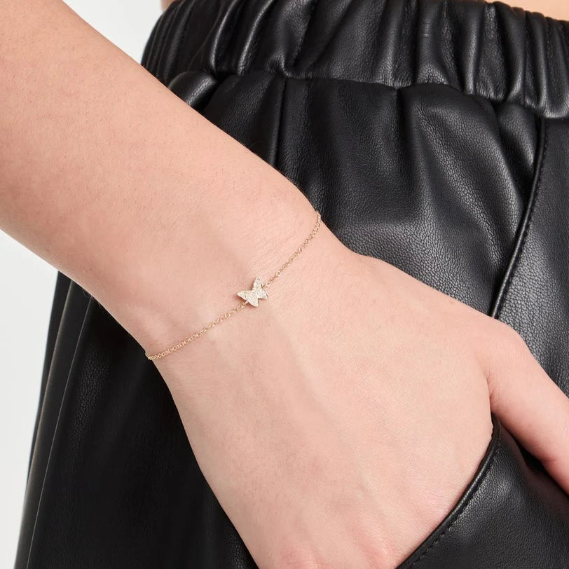 Single EF Collection Diamond Butterfly Bracelet in yellow gold on model's wrist. 