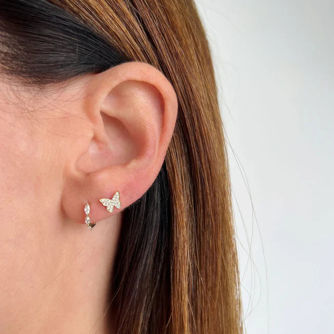 EF Collection Diamond Butterfly Stud Earring in yellow gold styled on models ear. 