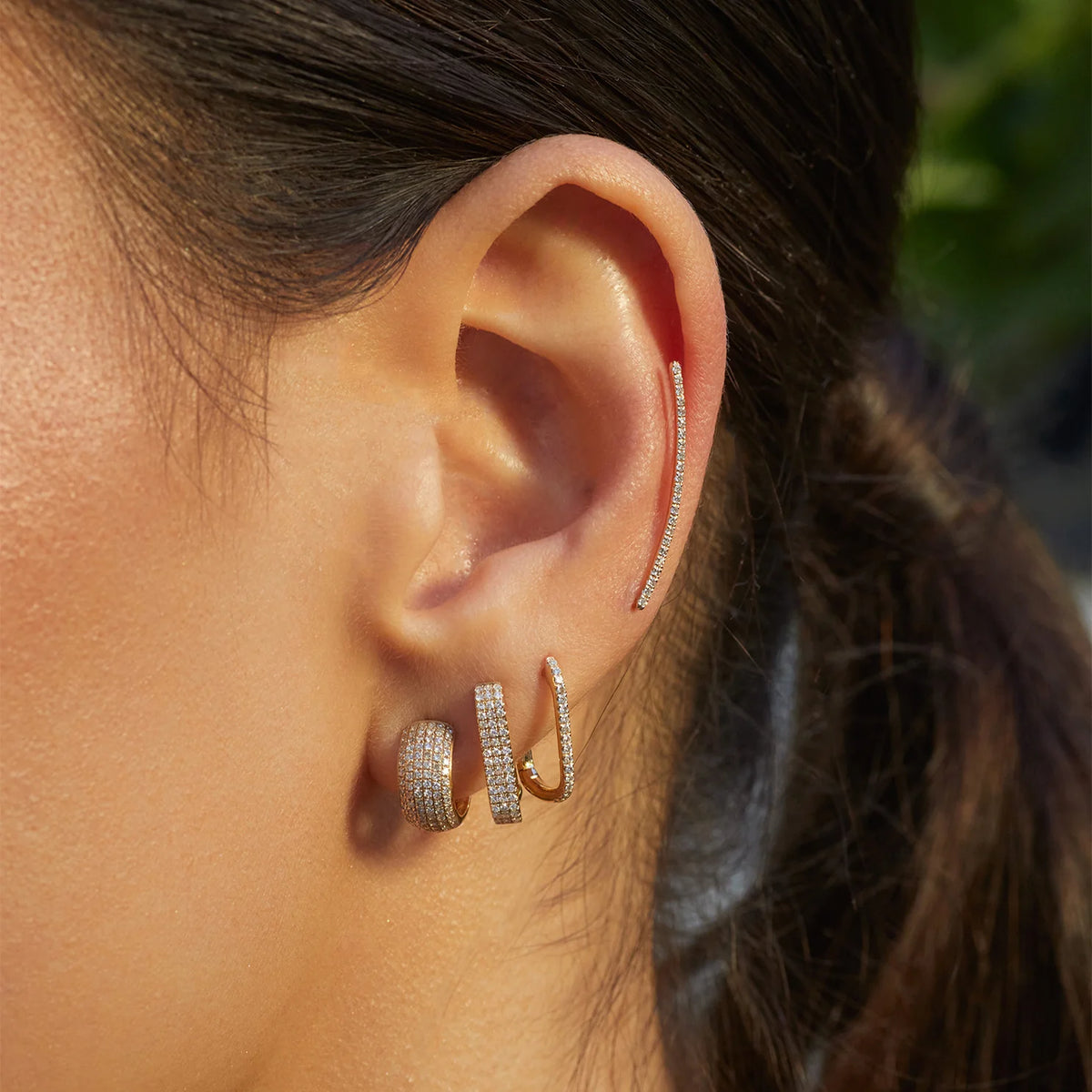 EF-Collection Diamond Curved Bar Ear Climber Earring in yellow gold styled on models ear