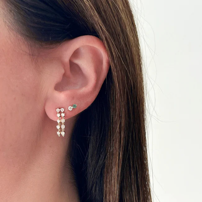 EF Collection Diamond & Emerald Double Stud Earring in yellow gold styled on models ear. 