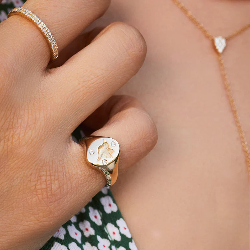 Close up of EF Collection Diamond Hummingbird Signet Ring in yellow gold 