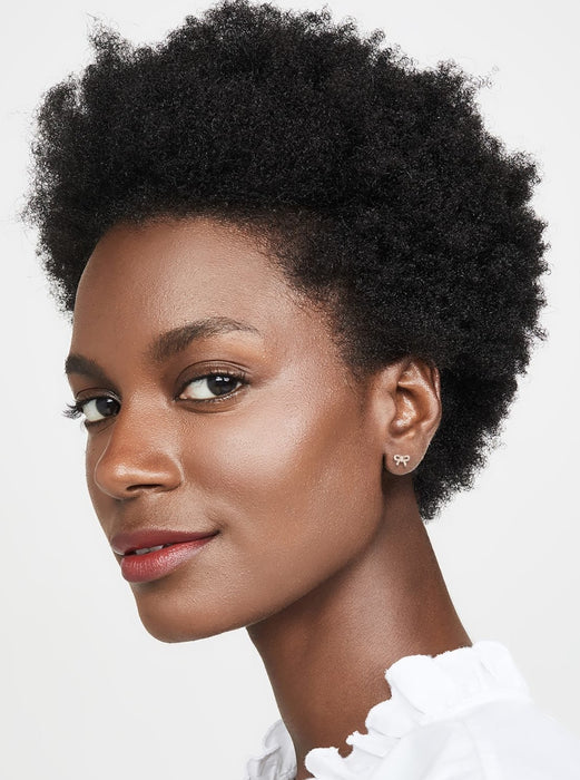 Single EF Collection Diamond Mini Bow Stud Earring styled on models ear.  