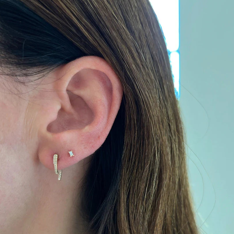 EF Collection Diamond Mini Hook Earring in yellow gold styled on models ear with diamond stud. 
