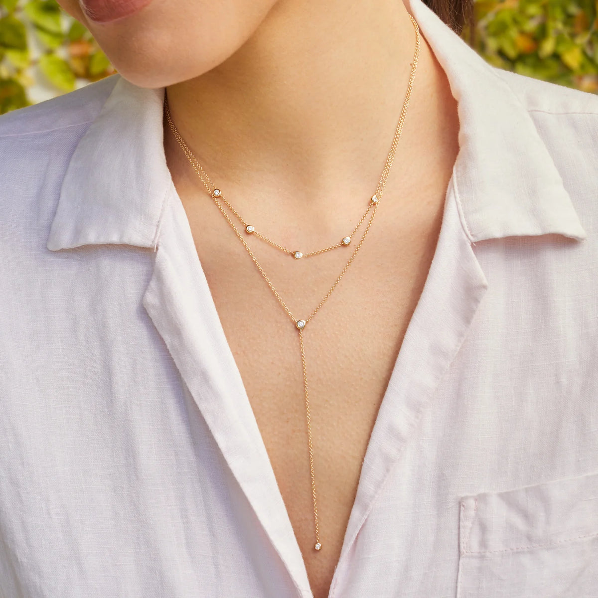 EF-Collection Diamond Pillow Lariat Necklace in yellow gold styled on models neck with beaded diamond necklace