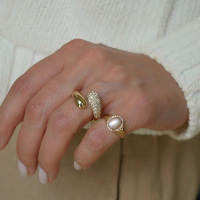 EF Collection Diamond & Pink Mother Of Pearl Cabochon Signet Ring in yellow gold on model’s finger