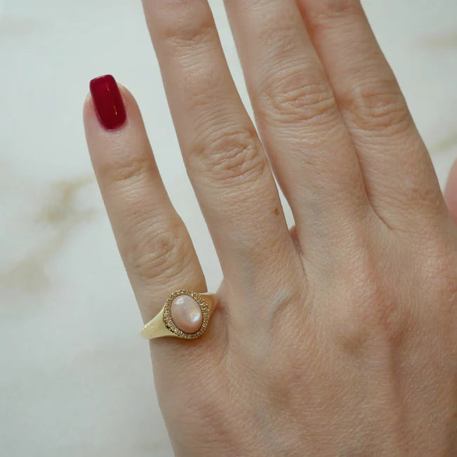 Single EF Collection Diamond & Pink Mother Of Pearl Cabochon Signet Ring in yellow gold on models finger with red nails. 