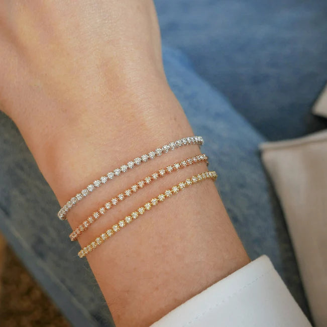Three EF Collection Diamond Segment Mini Link Bracelet in yellow gold styled on models wrist 