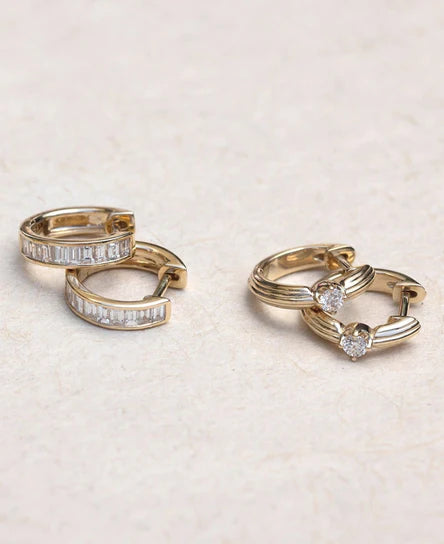 EF-Collection Diamond Zoe Huggie Earrings in yellow gold on a neutral background 