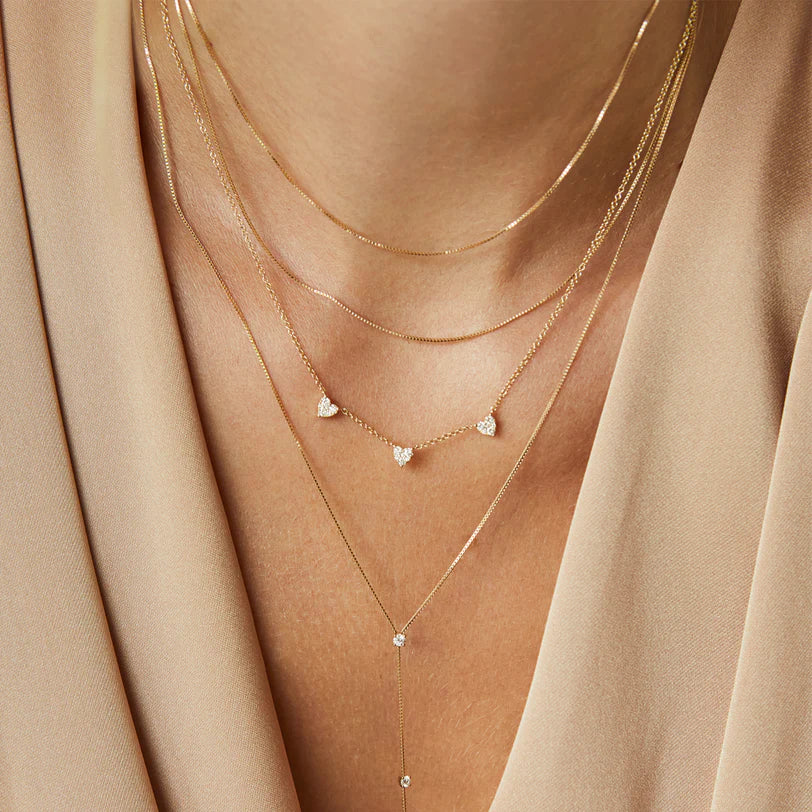 EF-Collection Double Strand Liquid Gold Necklace in yellow gold styled on models neck with diamond hearts necklace 