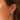 Dana Rebecca Designs Cynthia Rose Curved Diamond Huggies in yellow gold on models ear 