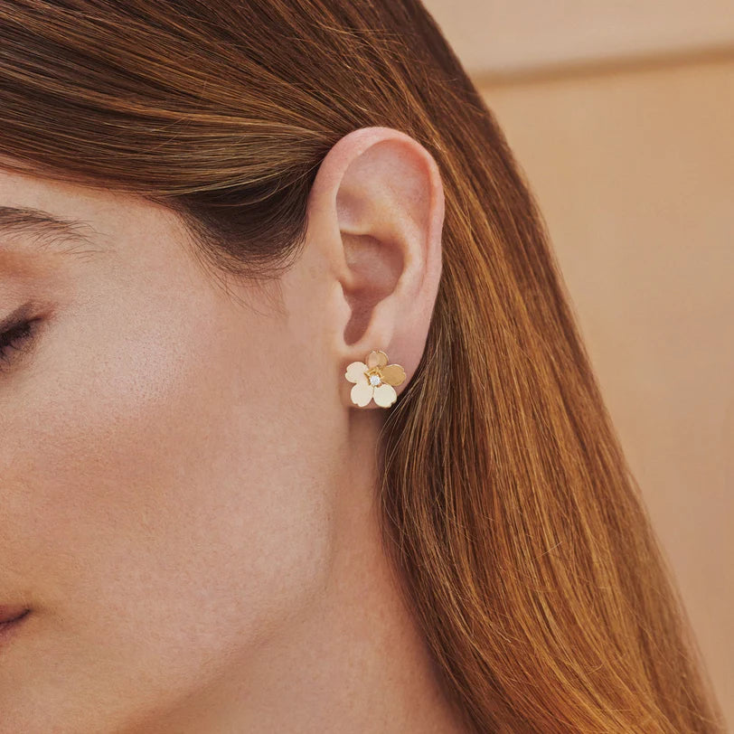 Close up of EF Collection Gold and Diamond Jumbo Cherry Blossom Stud Earrings in yellow gold on models ear. 
