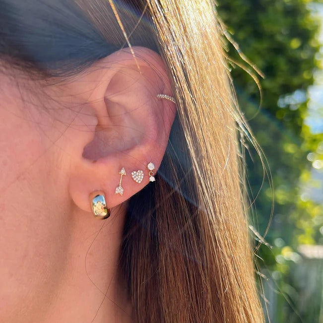 EF Collection Gold Bubble Huggie Earrings in yellow gold styled on models ear with diamond studs.  