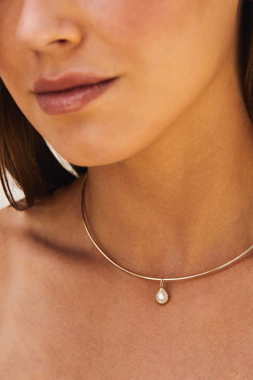 EF-Collection Gold Collar Necklace in yellow gold on models neck with a charm